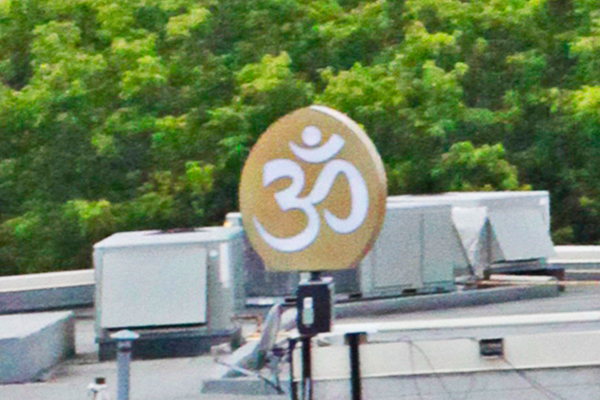 A revolving and lighted “AUM”